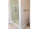 Bathroom shower stall features a clear glass door, grab bar and neutral tile floors at 216 Harrison Ln # 4, Locust, NC 28097