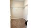 Walk-in closet with carpet and metal shelving for storage at 216 Harrison Ln # 4, Locust, NC 28097