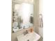 Cozy half bathroom features a square mirror, towel rings, and a neutral color scheme at 2313 Glenwood St, Kannapolis, NC 28083
