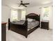 Spacious bedroom featuring a large bed, two windows, and two nightstands at 2313 Glenwood St, Kannapolis, NC 28083