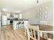Open-concept dining area with barstool seating and a view to the stainless steel kitchen at 2313 Glenwood St, Kannapolis, NC 28083