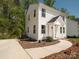 Charming two-story home with white siding, a covered front porch, and a well-manicured yard at 2313 Glenwood St, Kannapolis, NC 28083