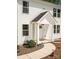 Exterior entrance featuring meticulously maintained lawn, well-kept mulch, and a pathway that leads to the residence at 2313 Glenwood St, Kannapolis, NC 28083