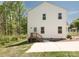 A bright two-story home offers a wooden back deck and a private yard with mature trees at 2313 Glenwood St, Kannapolis, NC 28083