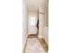 A bright mudroom that features a utility sink, coat rack, and ample natural light from the exterior door at 2313 Glenwood St, Kannapolis, NC 28083