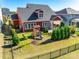 Aerial view of a home with a large backyard, a playset, manicured lawn, and a patio at 2329 Paddlers Cove Dr, Clover, SC 29710