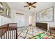 Well-lit Bedroom with a crib, a dresser, a world map, and a toy area, showcasing a cozy and educational space at 2329 Paddlers Cove Dr, Clover, SC 29710