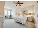 Inviting bedroom with a queen-sized bed, neutral decor, and ample natural light, creating a serene and cozy space at 2329 Paddlers Cove Dr, Clover, SC 29710