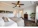 Cozy primary bedroom with tray ceiling, wooden ceiling fan, and hardwood floors offering a relaxing atmosphere at 2329 Paddlers Cove Dr, Clover, SC 29710