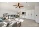 Bright living room featuring a ceiling fan, large windows, built-in shelving, and comfortable seating area at 2329 Paddlers Cove Dr, Clover, SC 29710