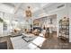 Open-concept living room with coffered ceilings and seamless flow to the kitchen at 2329 Paddlers Cove Dr, Clover, SC 29710