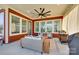 Stylish covered patio featuring comfortable seating, a ceiling fan, and ample natural light at 2329 Paddlers Cove Dr, Clover, SC 29710