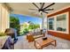 Charming covered patio with cozy seating, a grill, a view to the firepit and well-manicured lawn at 2329 Paddlers Cove Dr, Clover, SC 29710