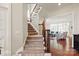 Elegant entryway featuring a staircase with wood and iron banisters and hardwood floors at 2610 Creek Manor Dr, Waxhaw, NC 28173