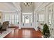 Grand foyer with hardwood floors, soaring ceilings, and elegant chandelier creates a welcoming entry at 2610 Creek Manor Dr, Waxhaw, NC 28173