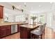 Bright and open kitchen featuring granite countertops, a breakfast bar, and stainless steel appliances at 2610 Creek Manor Dr, Waxhaw, NC 28173