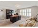 Spacious home office with large window and plantation shutters with desk and chairs at 2610 Creek Manor Dr, Waxhaw, NC 28173