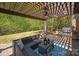 Outdoor seating area with pergola, grill, and landscaping with pavers at 2610 Creek Manor Dr, Waxhaw, NC 28173
