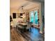 Elegant dining room features a rustic table and large windows, creating a warm, inviting atmosphere at 2656 Lee Lawing Rd, Lincolnton, NC 28092