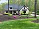 Charming home with a manicured lawn and landscaping, highlighting curb appeal and a welcoming entrance at 2656 Lee Lawing Rd, Lincolnton, NC 28092