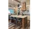 Modern kitchen boasts a large island, stainless steel appliances, and stylish pendant lighting for a sleek design at 2656 Lee Lawing Rd, Lincolnton, NC 28092