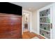 Bedroom featuring a large dresser with a TV, and a doorway to the attached bathroom at 2909 Park Rd, Charlotte, NC 28209