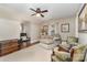 Bright and inviting bedroom with comfortable seating, ceiling fan, and stylish decor at 2909 Park Rd, Charlotte, NC 28209