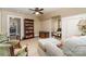 Spacious bedroom featuring hardwood floors, neutral paint, and a comfortable seating area at 2909 Park Rd, Charlotte, NC 28209