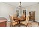 Cozy dining room featuring a round wood table, chandelier, and decorative rug at 2909 Park Rd, Charlotte, NC 28209