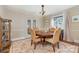 Cozy dining area featuring a round wooden table and four upholstered chairs at 2909 Park Rd, Charlotte, NC 28209