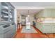 Open kitchen with green cabinetry, stainless appliances and island at 2909 Park Rd, Charlotte, NC 28209