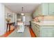 Charming kitchen boasts green cabinets, stainless steel appliances, and a center island at 2909 Park Rd, Charlotte, NC 28209