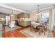 Eat-in kitchen featuring green cabinets, stainless appliances, and center island at 2909 Park Rd, Charlotte, NC 28209