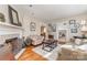 Cozy living room featuring a fireplace, hardwood floors, and comfortable seating at 2909 Park Rd, Charlotte, NC 28209