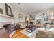 Cozy living room featuring a fireplace, hardwood floors, and comfortable seating at 2909 Park Rd, Charlotte, NC 28209