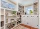 Bright office with built-in shelving, storage cabinets and large windows providing ample natural light at 2909 Park Rd, Charlotte, NC 28209