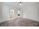 Bedroom featuring neutral walls and carpet with two doorways, one leading to the bathroom at 2959 Bellasera Way, Matthews, NC 28105