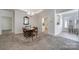 Spacious dining room featuring a chandelier and large carpeted area at 2959 Bellasera Way, Matthews, NC 28105