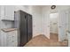 Bright kitchen features stainless steel refrigerator, white cabinets, and a pantry at 2959 Bellasera Way, Matthews, NC 28105