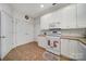 Bright kitchen features white cabinets, appliances, and tile backsplash at 2959 Bellasera Way, Matthews, NC 28105