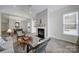 Open living space with fireplace and seamless connection to dining area at 2959 Bellasera Way, Matthews, NC 28105