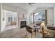 Comfortable living room with a fireplace and views into the sunroom at 2959 Bellasera Way, Matthews, NC 28105