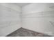 Spacious walk-in closet featuring carpeted floors and multiple levels of wire shelving for optimal storage at 2959 Bellasera Way, Matthews, NC 28105