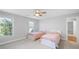 Bedroom with two beds, neutral carpet and a ceiling fan at 3677 Antioch Church Rd, Matthews, NC 28104