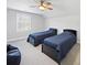 Bedroom with two beds, neutral carpet and a ceiling fan at 3677 Antioch Church Rd, Matthews, NC 28104