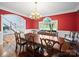 Elegant dining room featuring hardwood floors, crown molding, and a traditional chandelier at 3677 Antioch Church Rd, Matthews, NC 28104