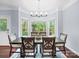 Inviting dining room with natural light from bay windows and comfortable seating for six at 3677 Antioch Church Rd, Matthews, NC 28104