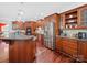Well-equipped kitchen features wooden cabinetry, stainless steel appliances, and granite countertops at 3677 Antioch Church Rd, Matthews, NC 28104