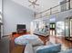 Open-concept living room with hardwood floors, soaring ceilings, and a cozy fireplace at 3677 Antioch Church Rd, Matthews, NC 28104
