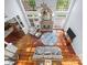 Open-concept living room features soaring ceilings, a stone fireplace, and walls of windows at 3677 Antioch Church Rd, Matthews, NC 28104